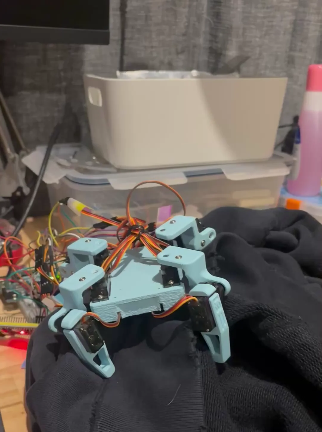 Sesame Robot posed on a work surface after movement programming